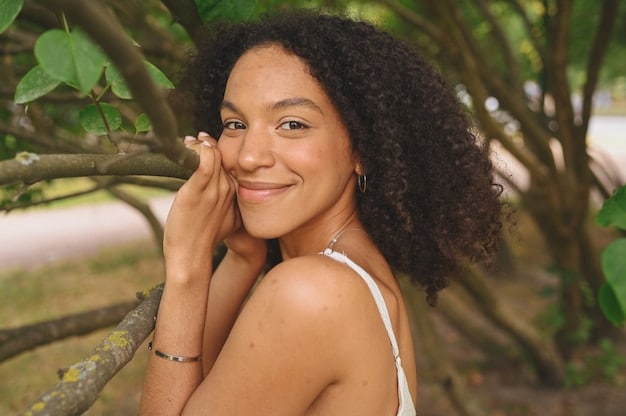 A woman with healthy, glowing skin is seen smiling and enjoying a sunny day outdoors. She is wearing a sun hat and sunglasses, emphasizing the importance of sun protection. The focus is on her radiant complexion, showcasing the positive effects of a consistently hydrating skincare routine.