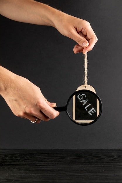 A visual representation of a magnifying glass examining a discount tag on a clothing item, symbolizing the act of carefully inspecting and researching deals for maximum savings. The background shows various fashion items blurred to keep the focus on the discount tag.