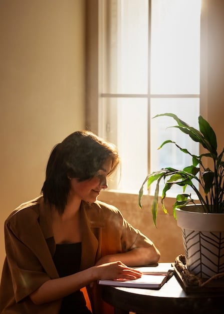 A person using a journal to track their mindfulness practice, with a positive expression of self-reflection and awareness.