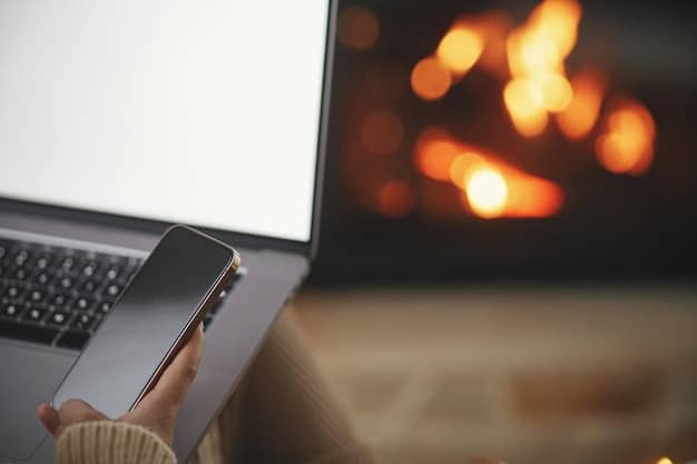 A person using a computer with a blue light filter app activated, showing the screen with a warmer, amber tint.
