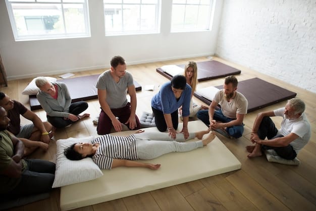 A wide shot of a group of people lying down in a circle during a gong bath, with a practitioner playing a large gong in the center, illustrating a communal and immersive experience.