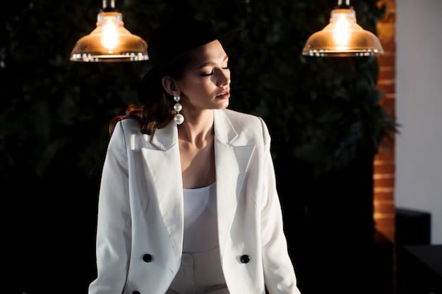 A close-up shot of a woman accessorizing her blazer with a statement necklace and swapping her work tote for a chic clutch. The background is a blurred, elegant restaurant setting at dusk.